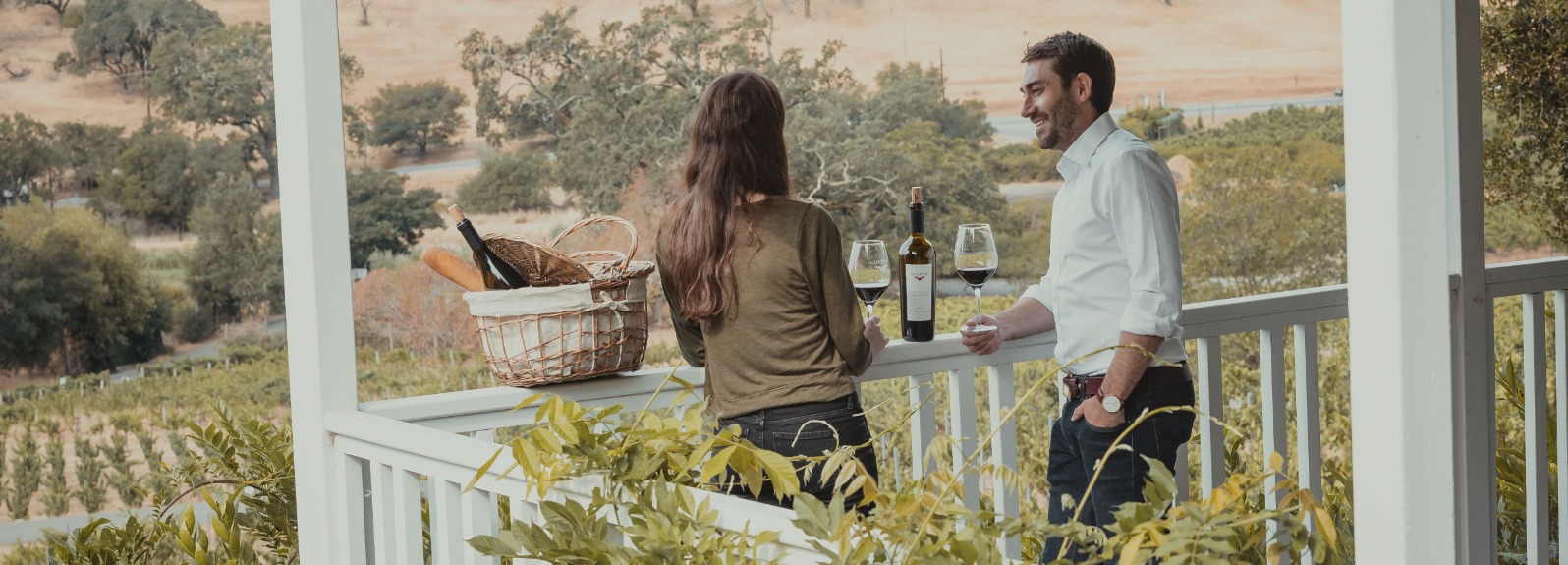 Couple with wine on  a patio